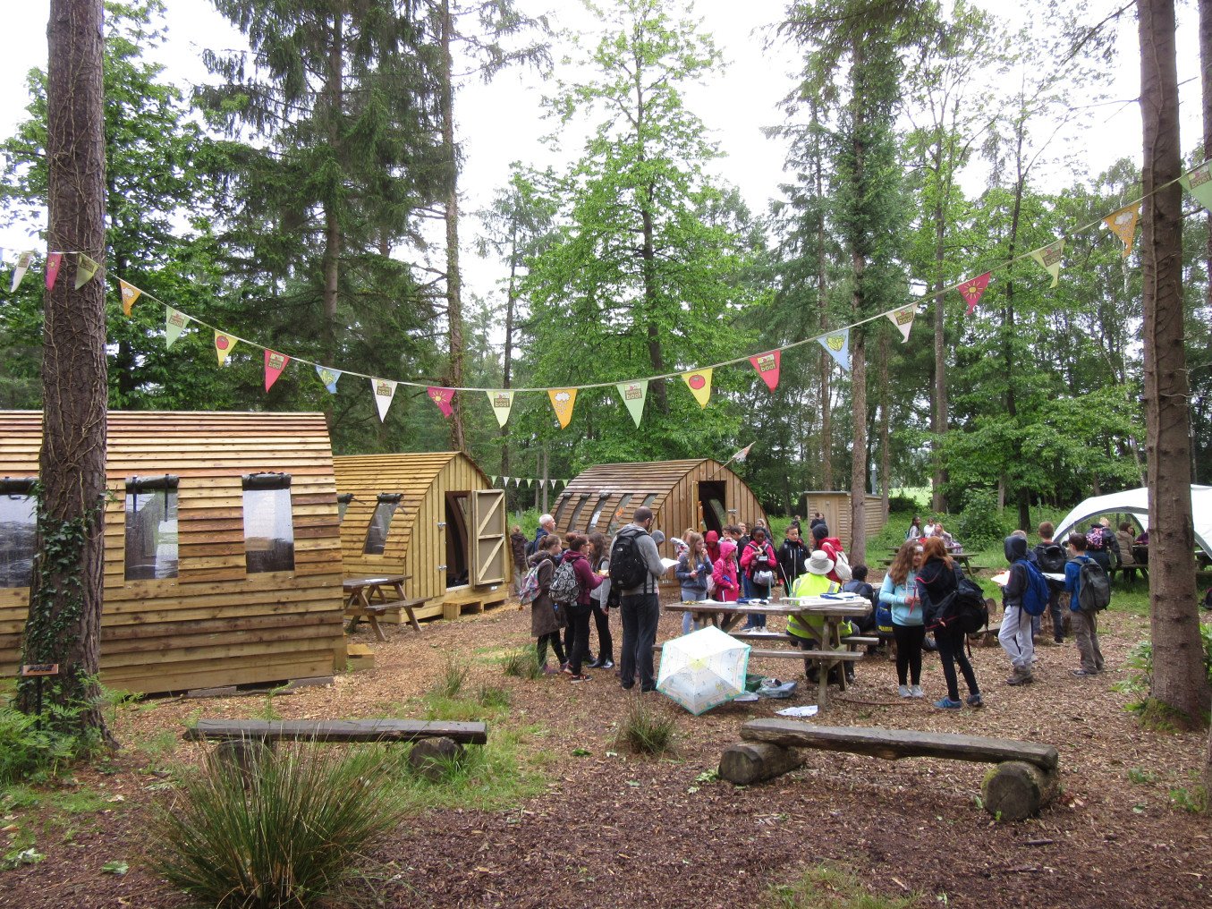 Thornden School Foxbury Visit 2017 Large group of people around wood cabins