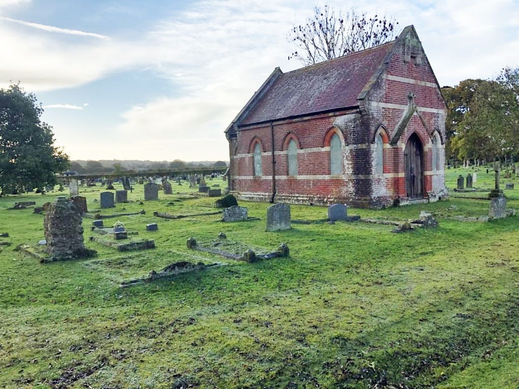 A chapel surrounded by gravestones