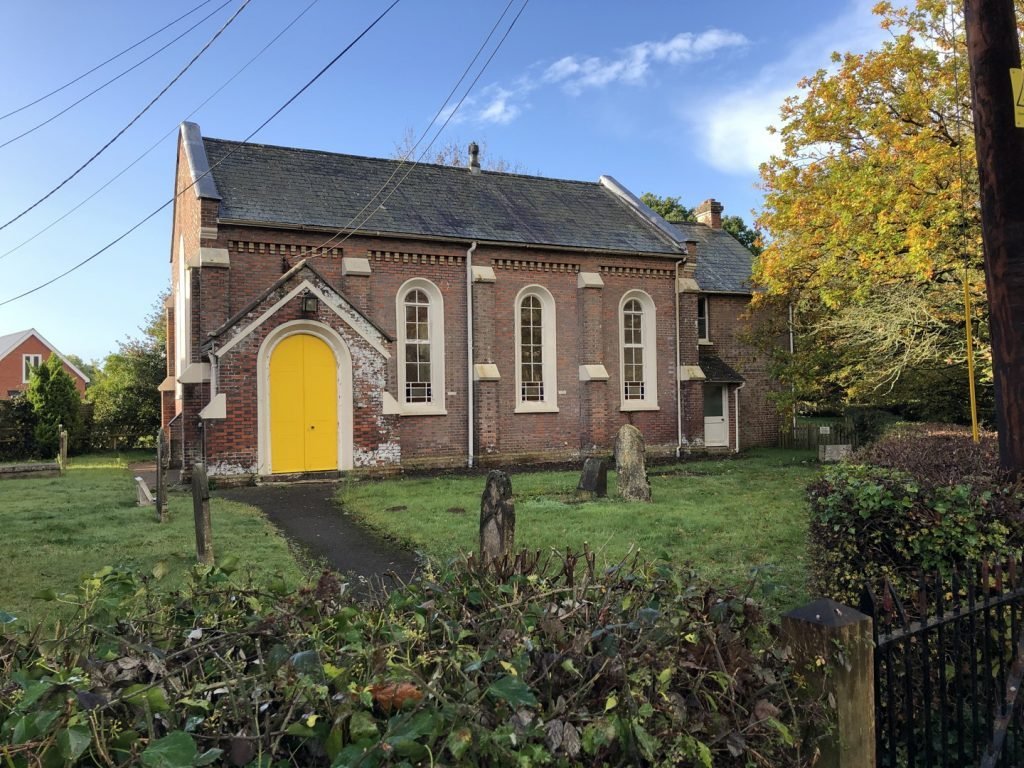 A church with a bright yellow door