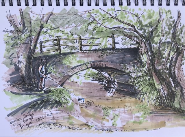 Forest stream awith a brick bridge, person standing with fishing net in the river