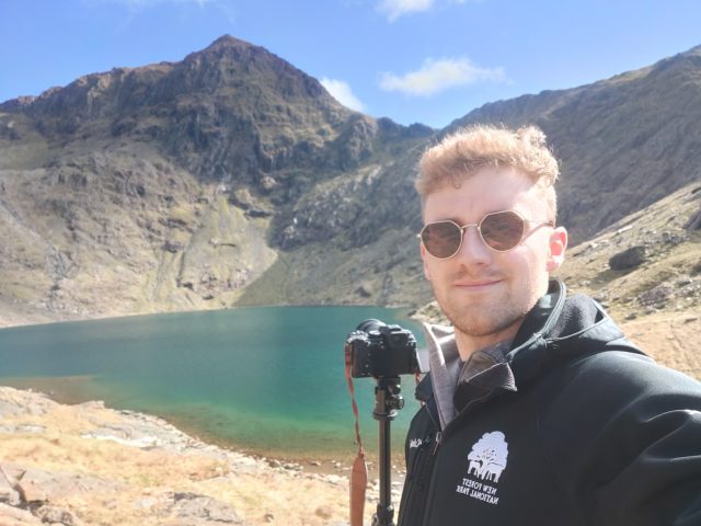 Picture of Chris Fairhead with Mount Snowdon in the background on a sunny day