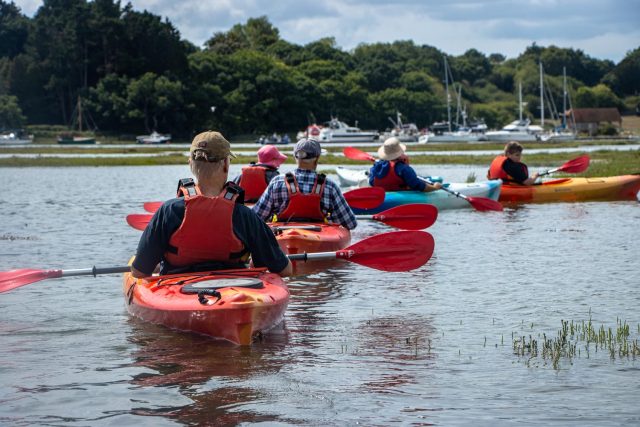 New Forest Ambassadors litter picking on kayaks down Beaulieu river 