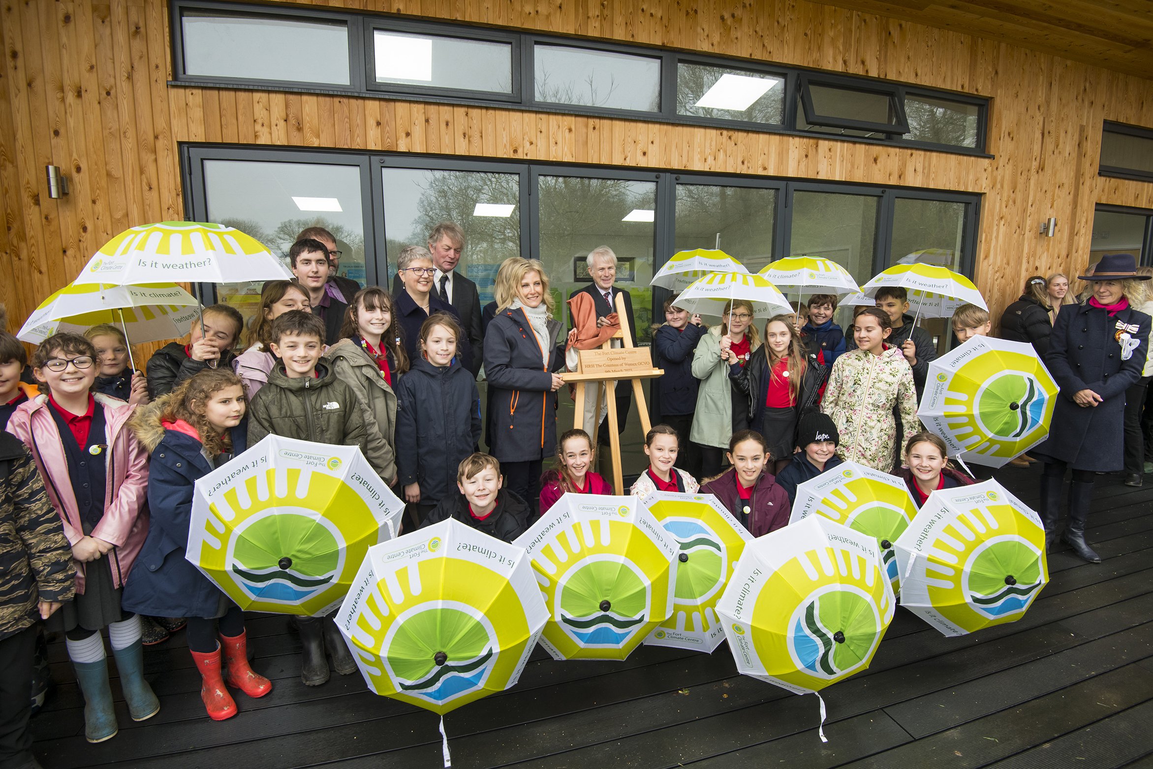 The Duchess of Edinburgh outside wooden building Fort Climate Centre with Lord Montagu & Beaulieu School children, Countryside Education Trust, Beaulieu