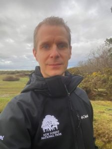 John Stride, the New Forest National Park Authority’s new Net Zero with Nature Programme Manager, standing in the Forest.