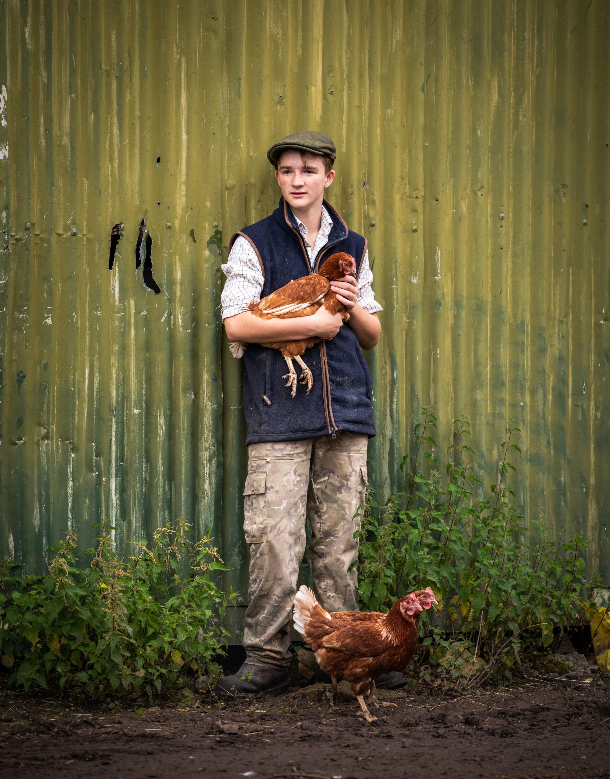 Young commoner Will Parry-Norton holding a chicken