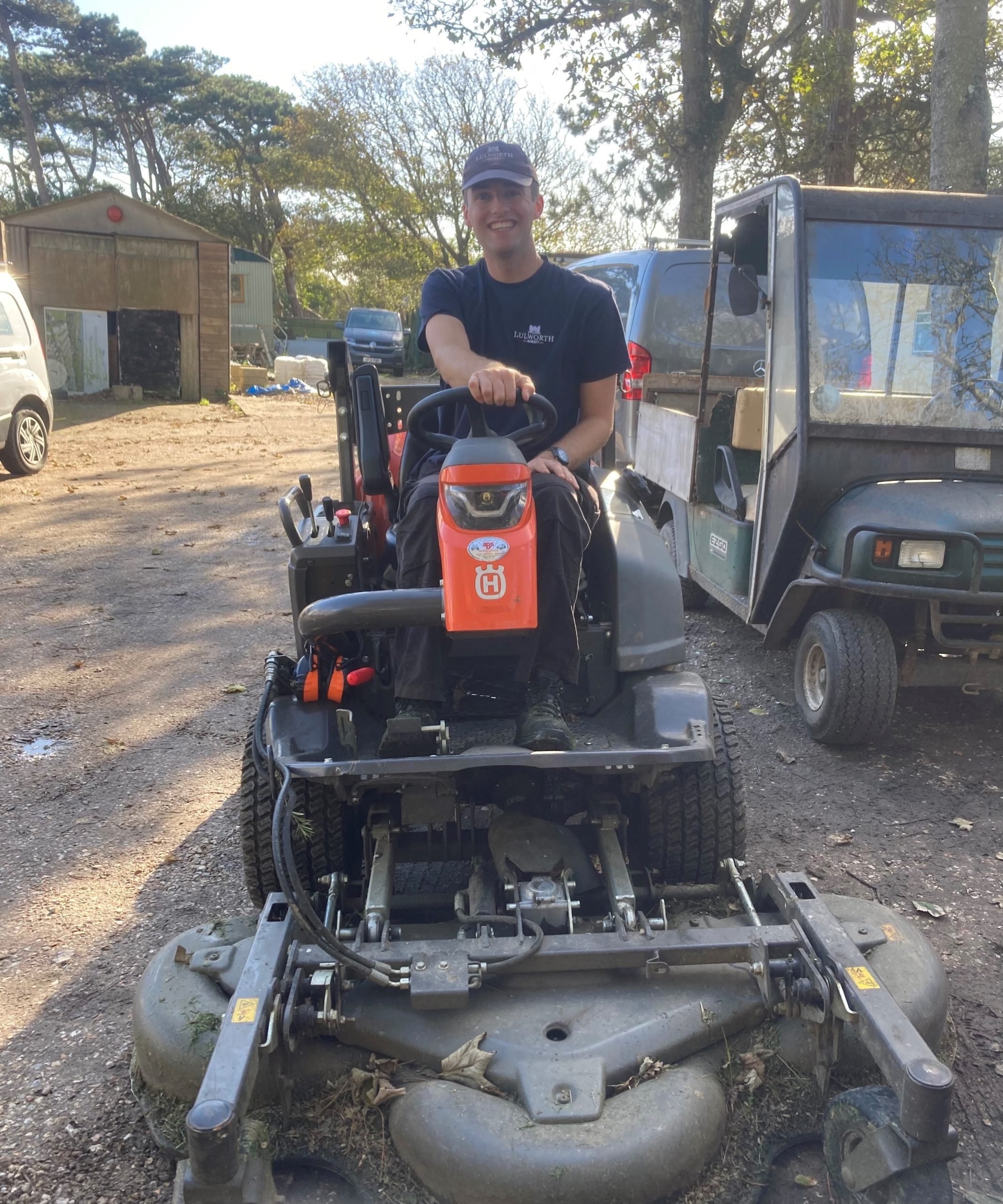 Ben performing ground maintenance at Lulworth Estate Former New Forest apprentice ranger Ben on a sit on lawn mower
