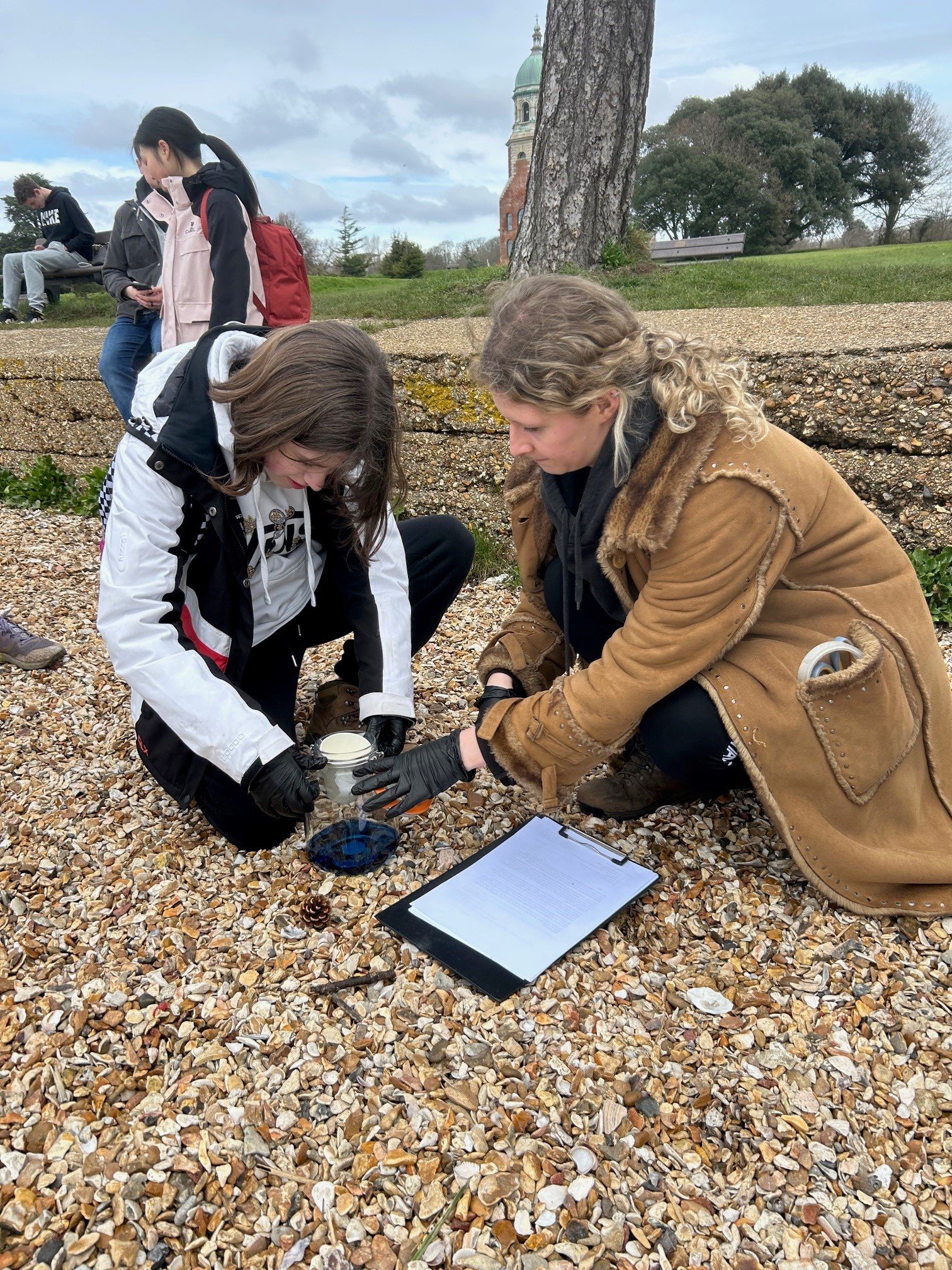 Ocean acidification explorations with marine biologist Holly Jenkins, Southampton (credit TFL) Two people testing sea water for acidification levels