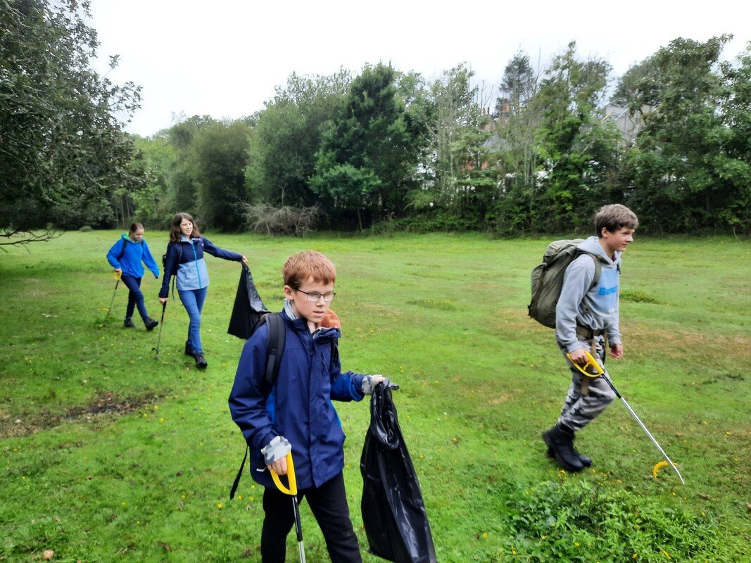 Junior rangers on a litter pick Teenagers with litter pickers as part of a junior rangers session in the New Forest