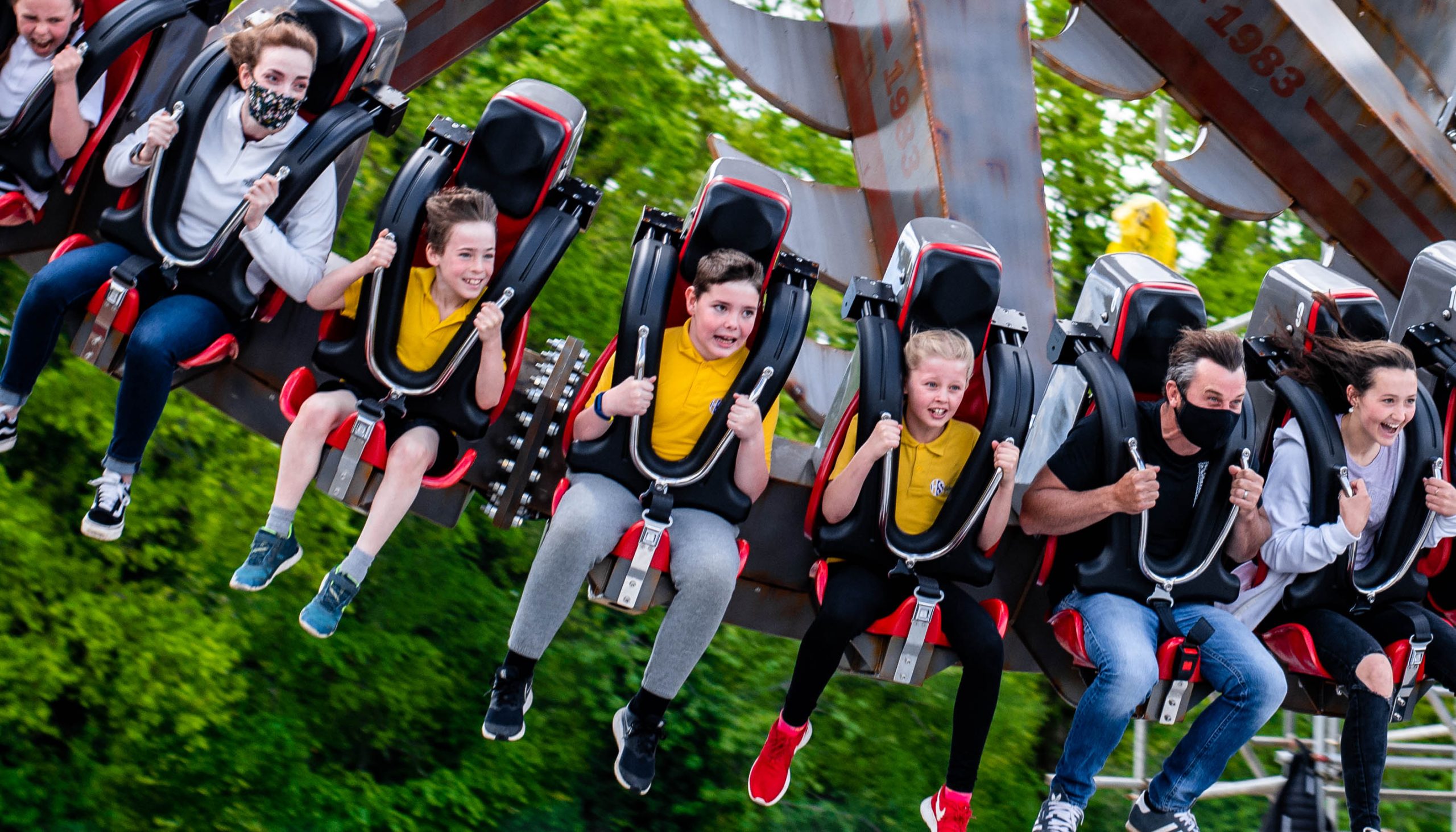 A group of children on a rollercoaster