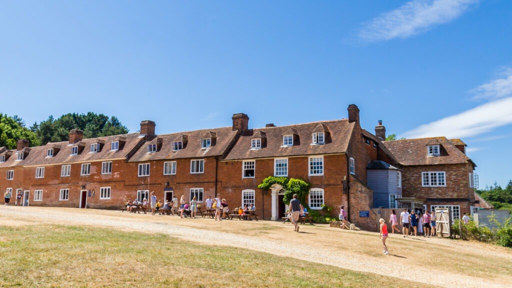 A row of terraced houses with a gravel track in front