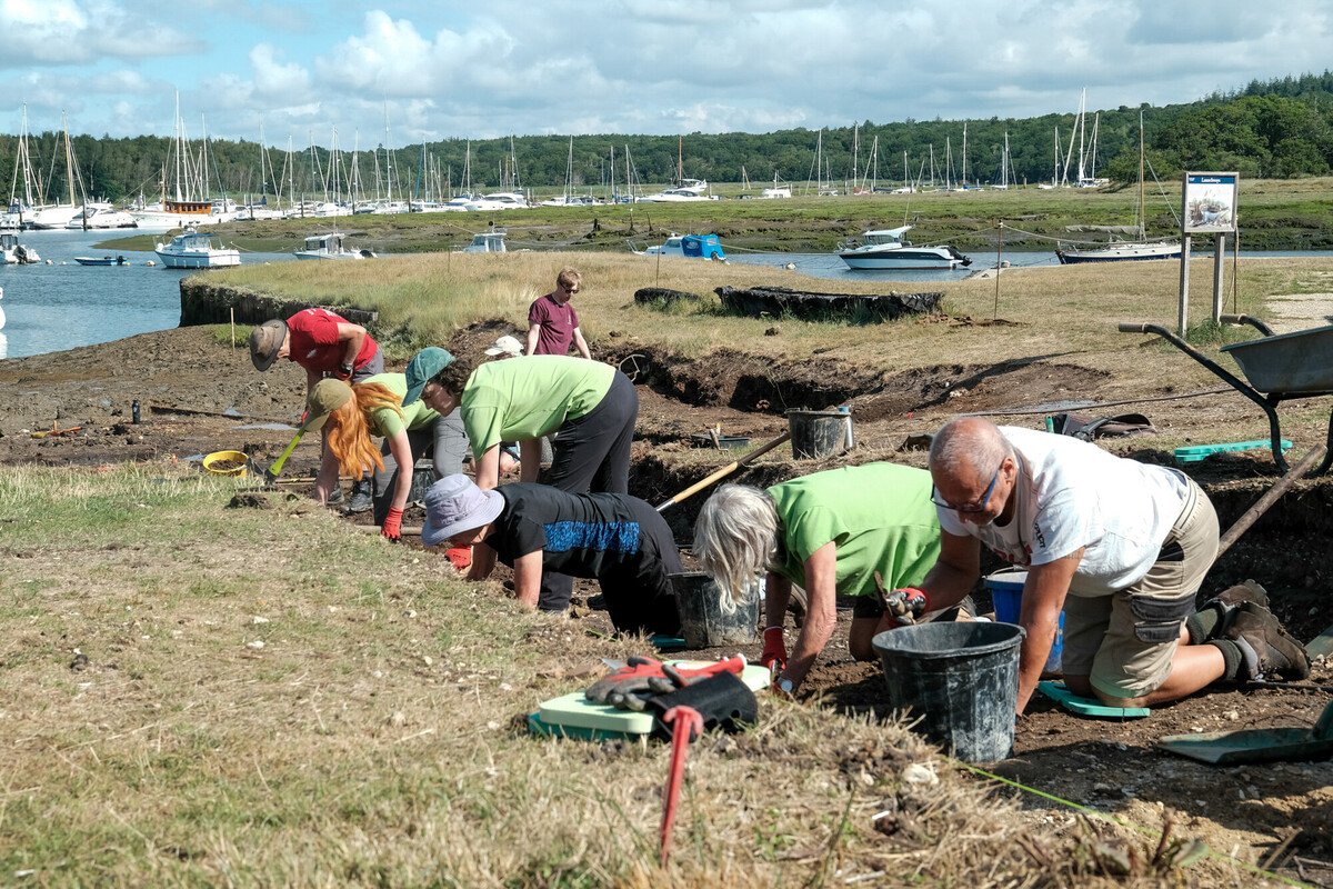 A line of NPA volunteers digging a trench during an excavation at Buckler's Hard.