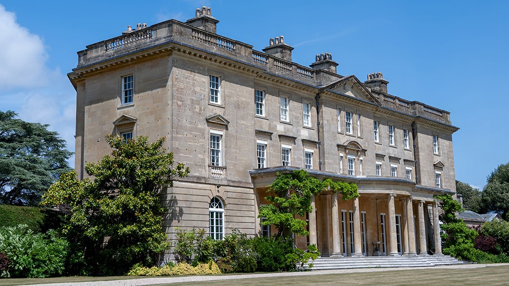 Large stone country mansion in the sunshine