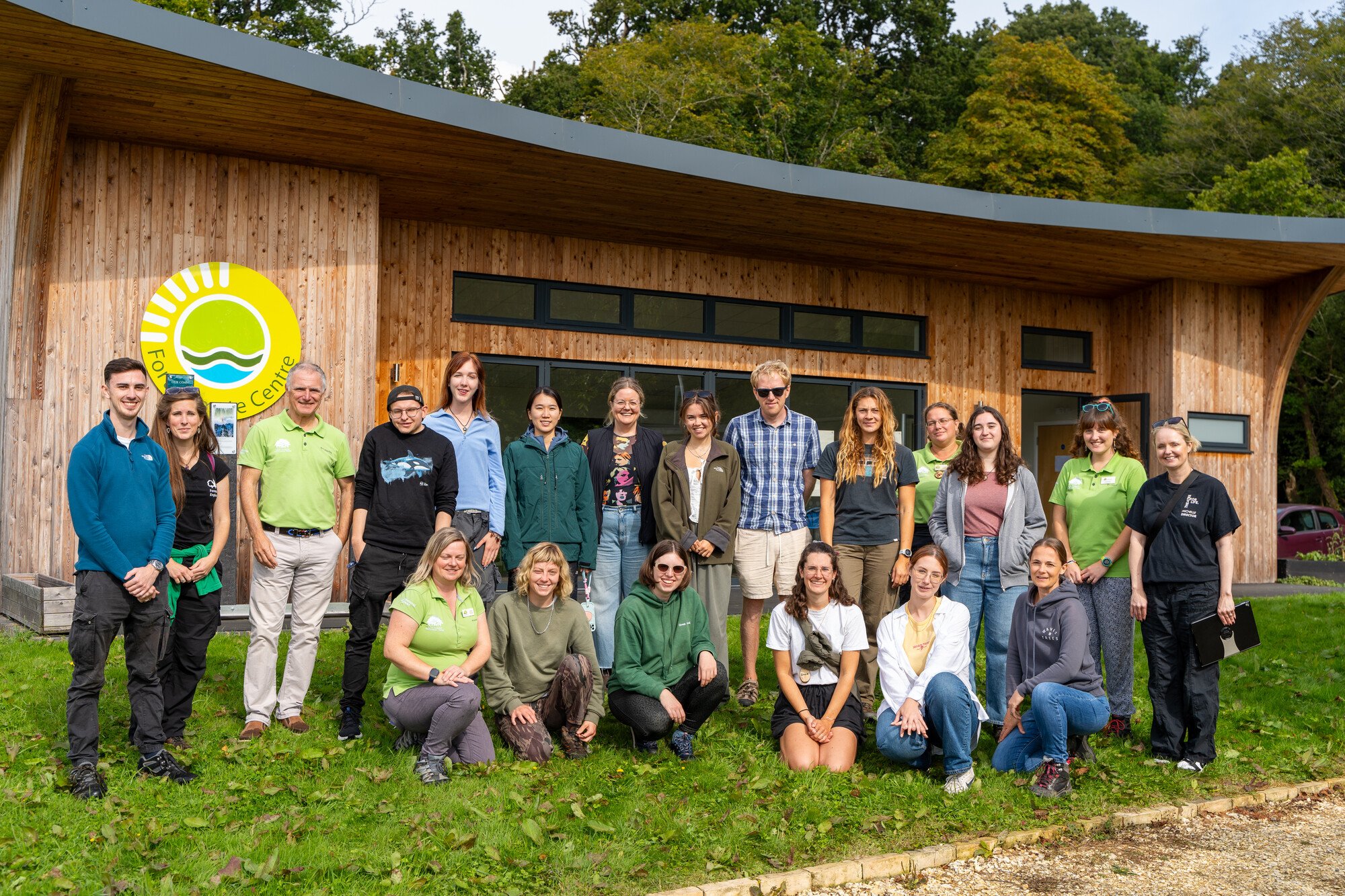 The New Forest Youth Board members and staff from the NPA, Freshwater Habitats Trust, Theatre for Life, Forestry England and Culture in Common outside the Fort Climate Centre at the Countryside Education Trust