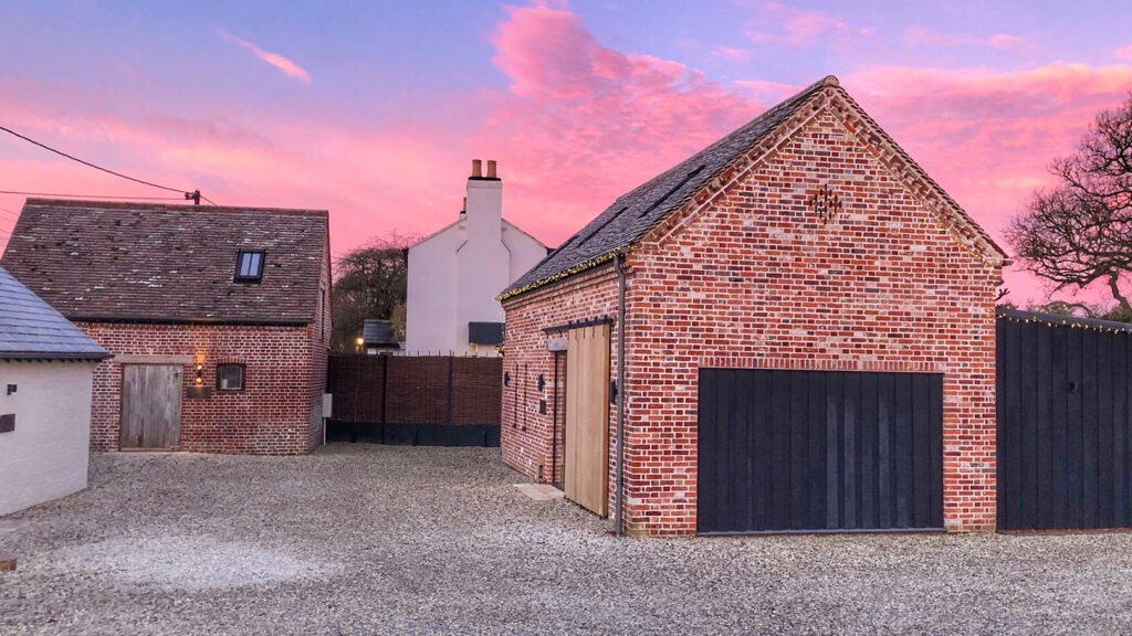 Renovated agricultural buildings at sunset