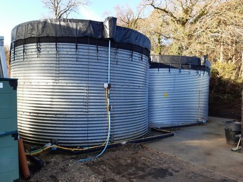 two metal water tanks