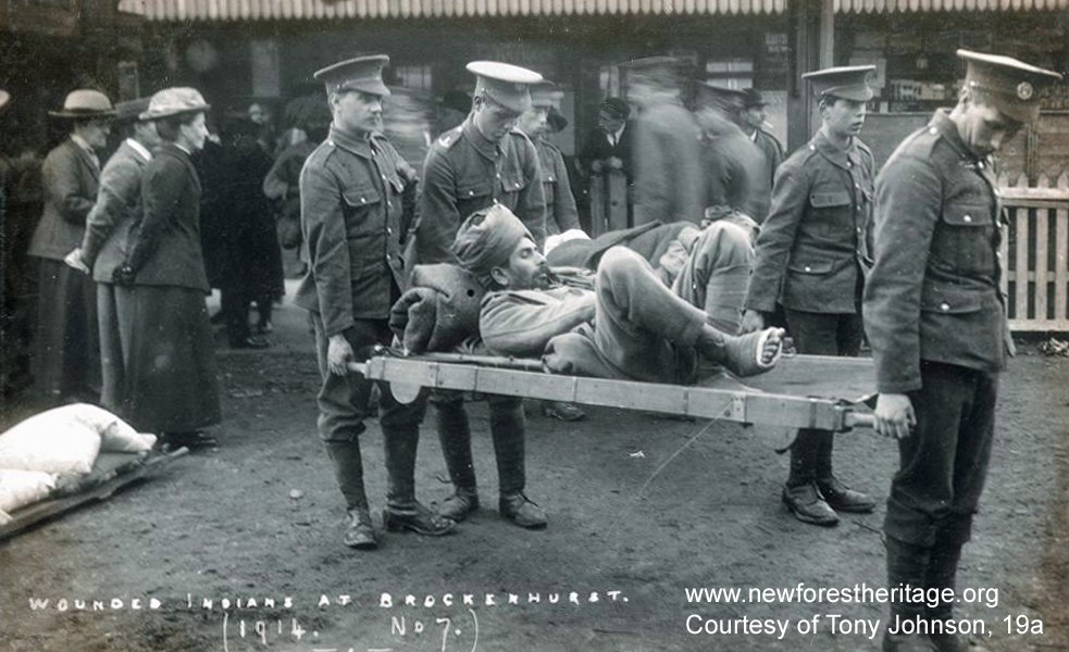 Wounded-Indian-soldier-being-carried-on-a-stretcher-Brockenhurst-Station.-Wounded-Indians-at-Brockenhurst.-1914.-No.7