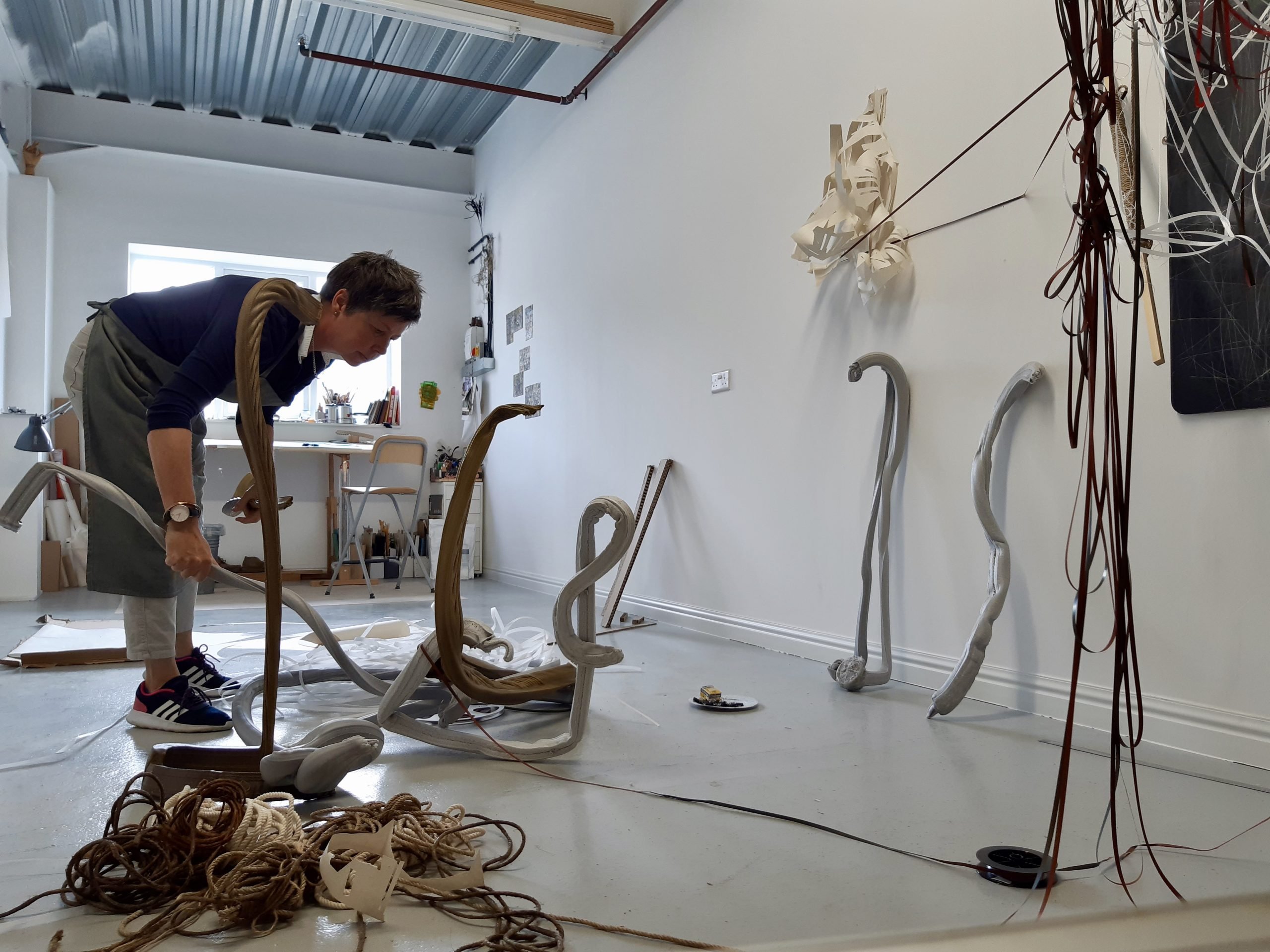 New Forest National Park Artist in Residence Alex Julyan in a studio working on a sculpture piece