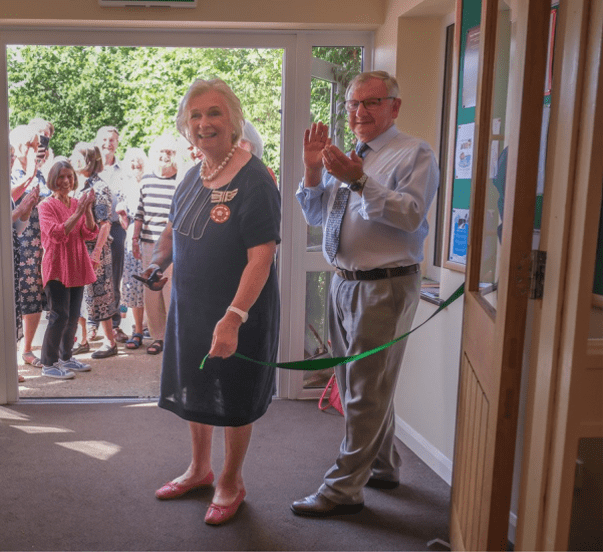 The opening of a new building ribbon cutting