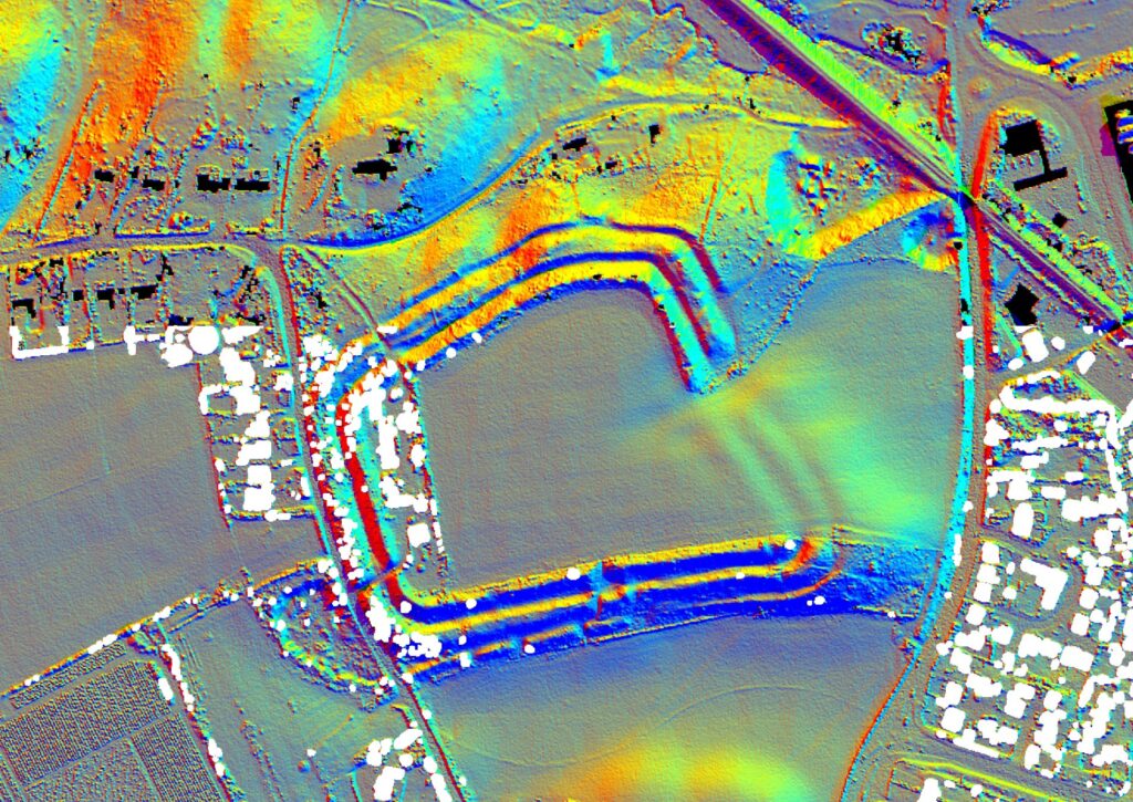 False-colour LiDAR map of Buckland Rings hill fort near Lymington, showing concentric ramparts and ditches among roads and buildings