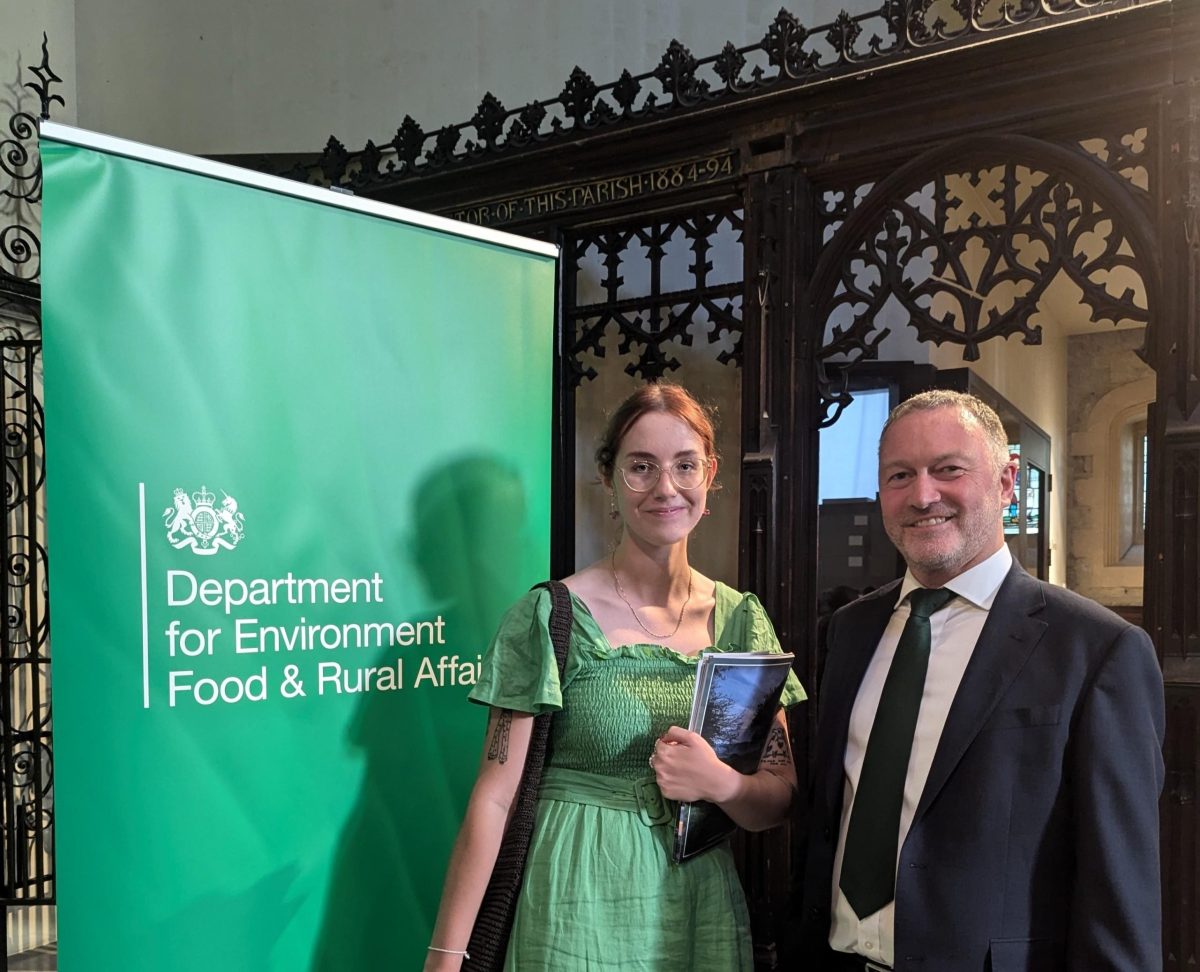 Hayley stood next to Secretary of State Steve Reed and a green banner for Department for Environment, Food and Rural Affairs