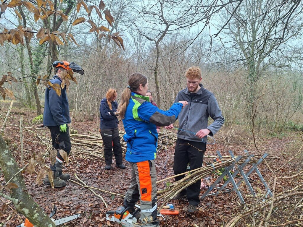 Interns at the Countryside Education Trust are taught green skills like woodland management and coppicing.