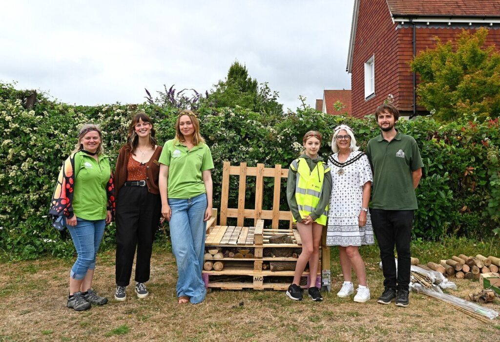 Caption: (L to R) Claire Pearce, New Forest NPA Youth Development Officer, Georgia Staszynska, Freshwater Habitats Trust Engagement Officer, Honor Burgess, New Forest Youth Board member, Junior Ranger, Cllr Rae Frederick, Ringwood Town Mayor, and Will Bowskill, The Parks Foundation Young Adult Ranger Programme Lead stand beside the new bug hotel at New Forest Thrive festival 2025 Credit: New Forest National Park Authority