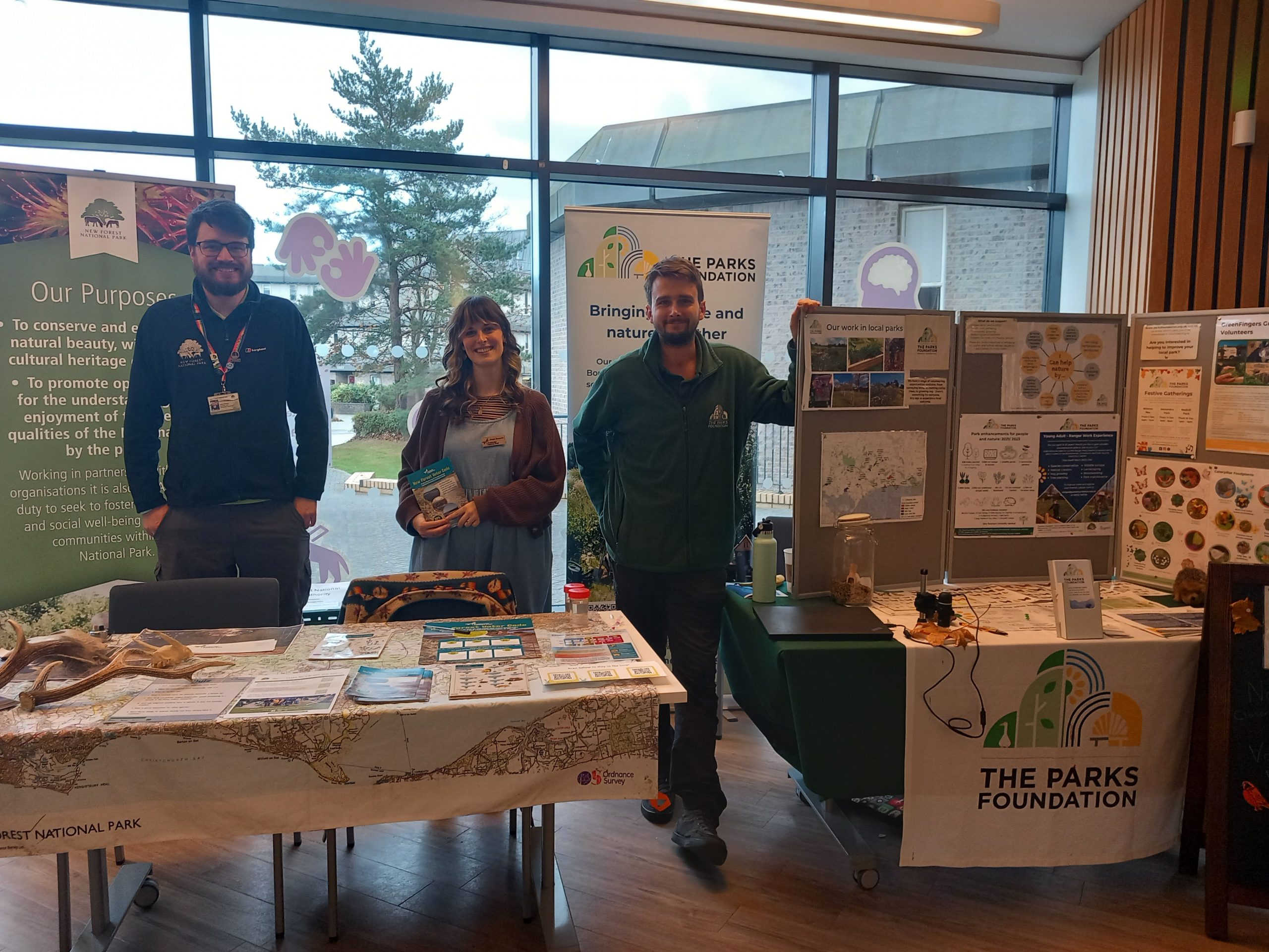 NPA volunteer co-ordinator James Masser, Freshwater Habitats Trust Engagement Officer Georgia Staszynska and The Parks Foundation Young Ranger Programme Lead Will Bowskill at Bournemouth University's volunteer fair