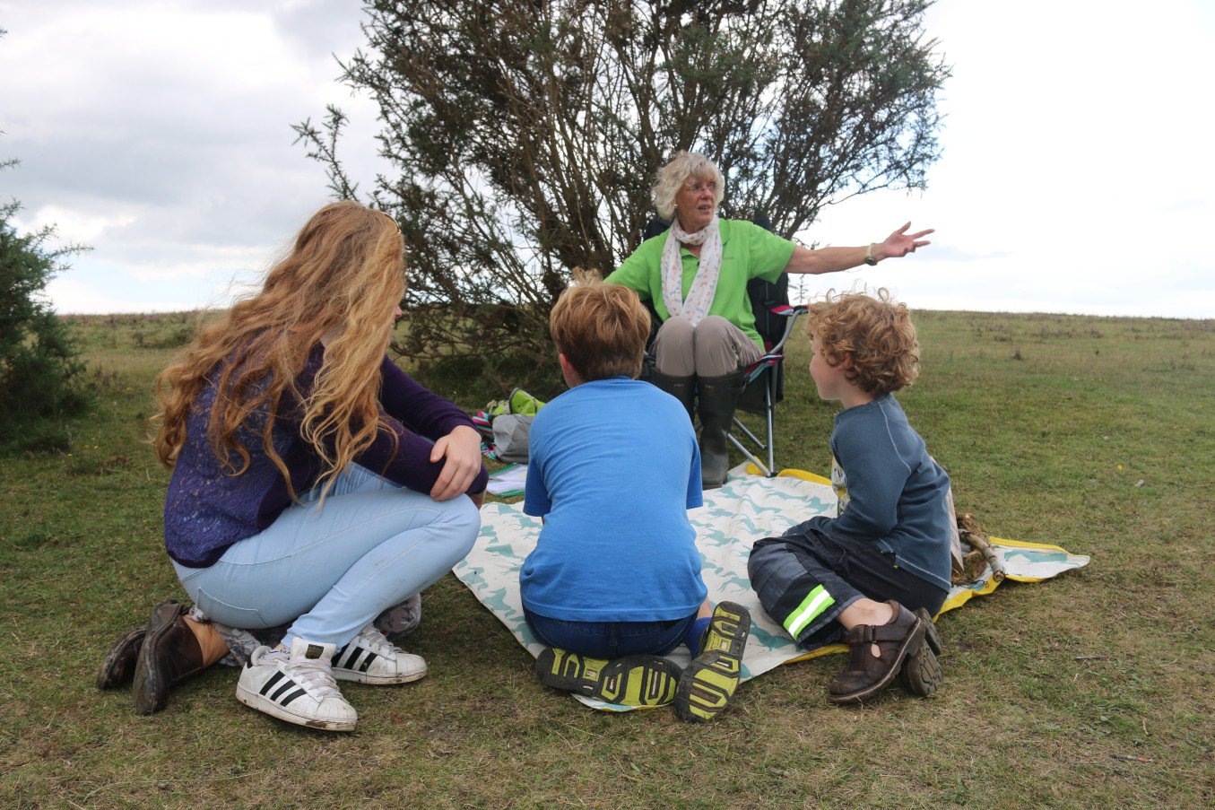 A ranger talks to children
