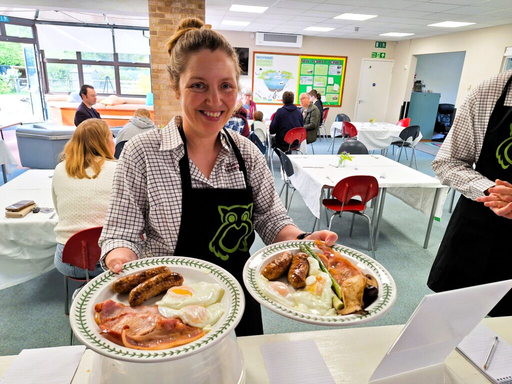 Manager Anna Hanks serving up a local produce breakfast at the Countryside Education Trust