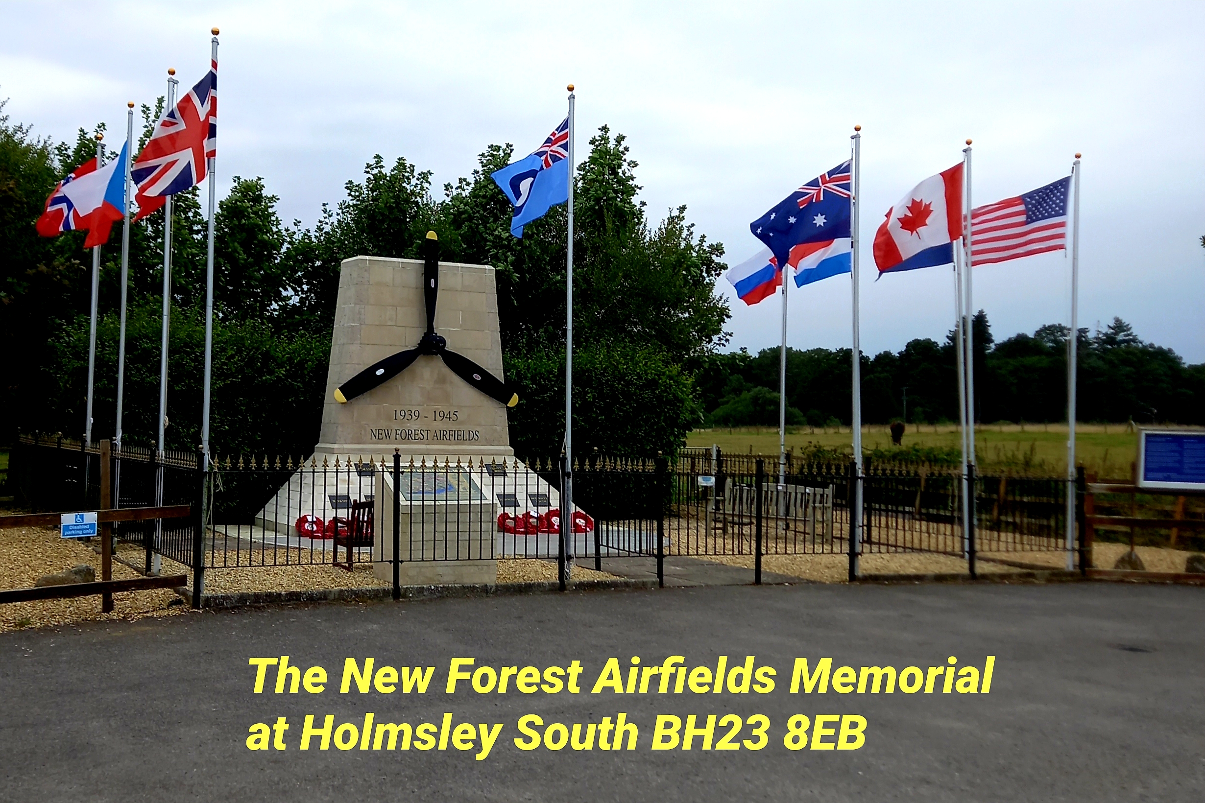 New Forest Airfields Memorial with propeller monument and flags, labeled Holmsley South BH23 8EB