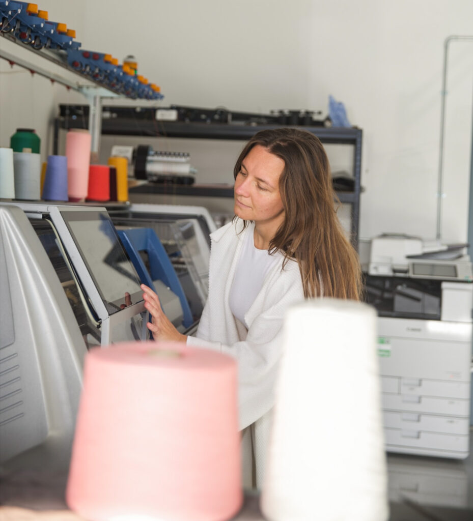 lady working with a digital textiles machine