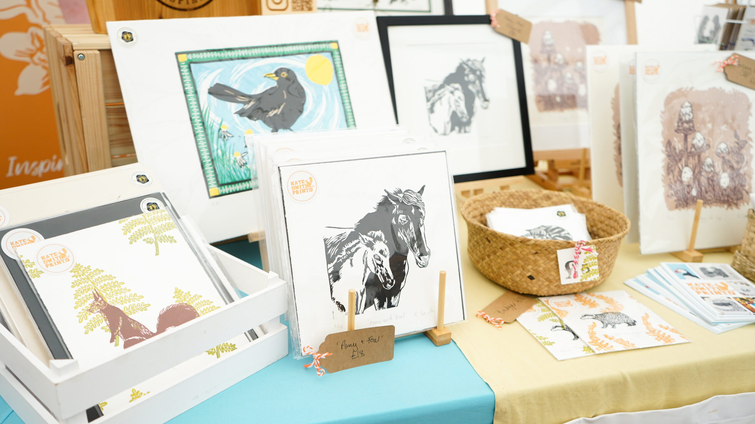 Art prints displayed on a stall