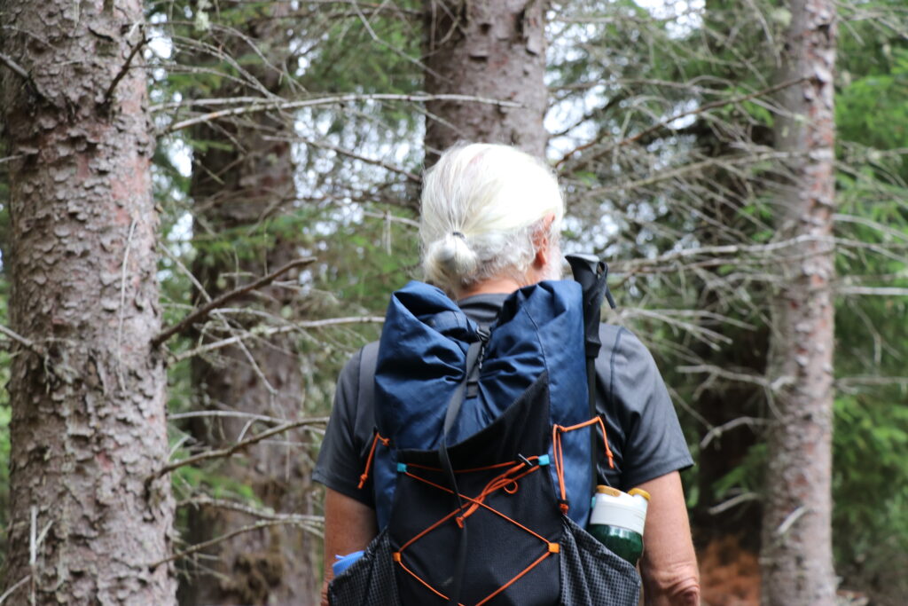 Man with a backpack in woodland