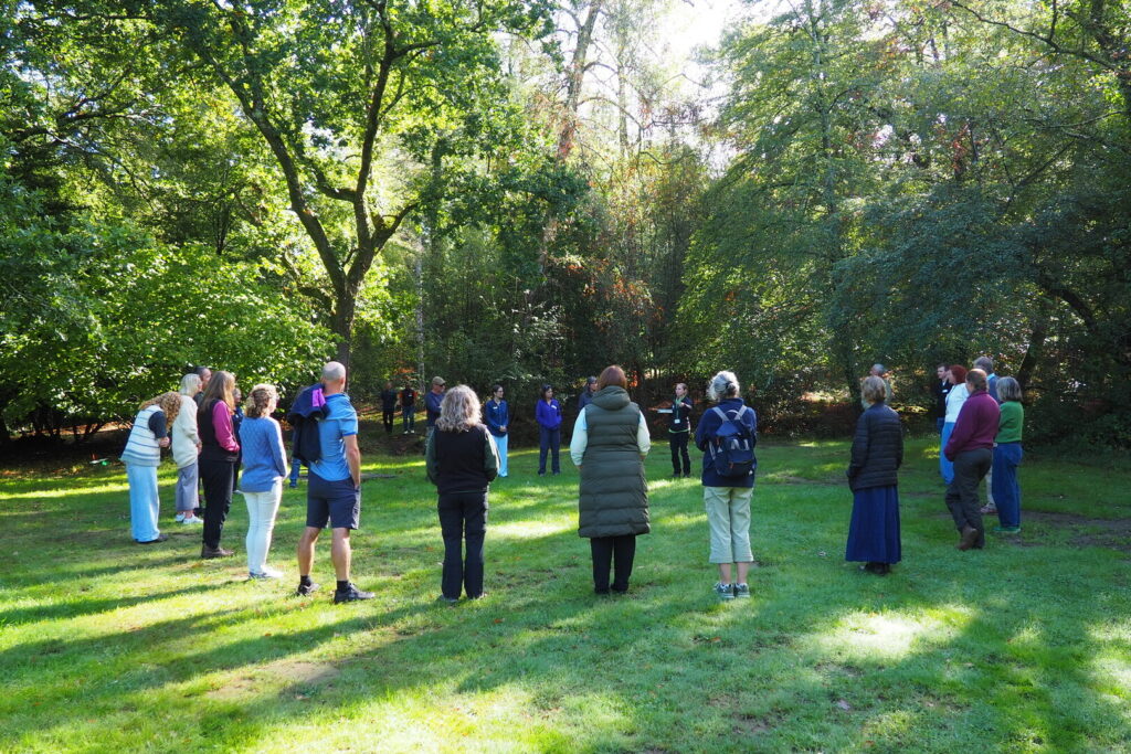 Attendees at the Green Health Hub's autumn Connect and Learn event take part in a mindful nature connection session.